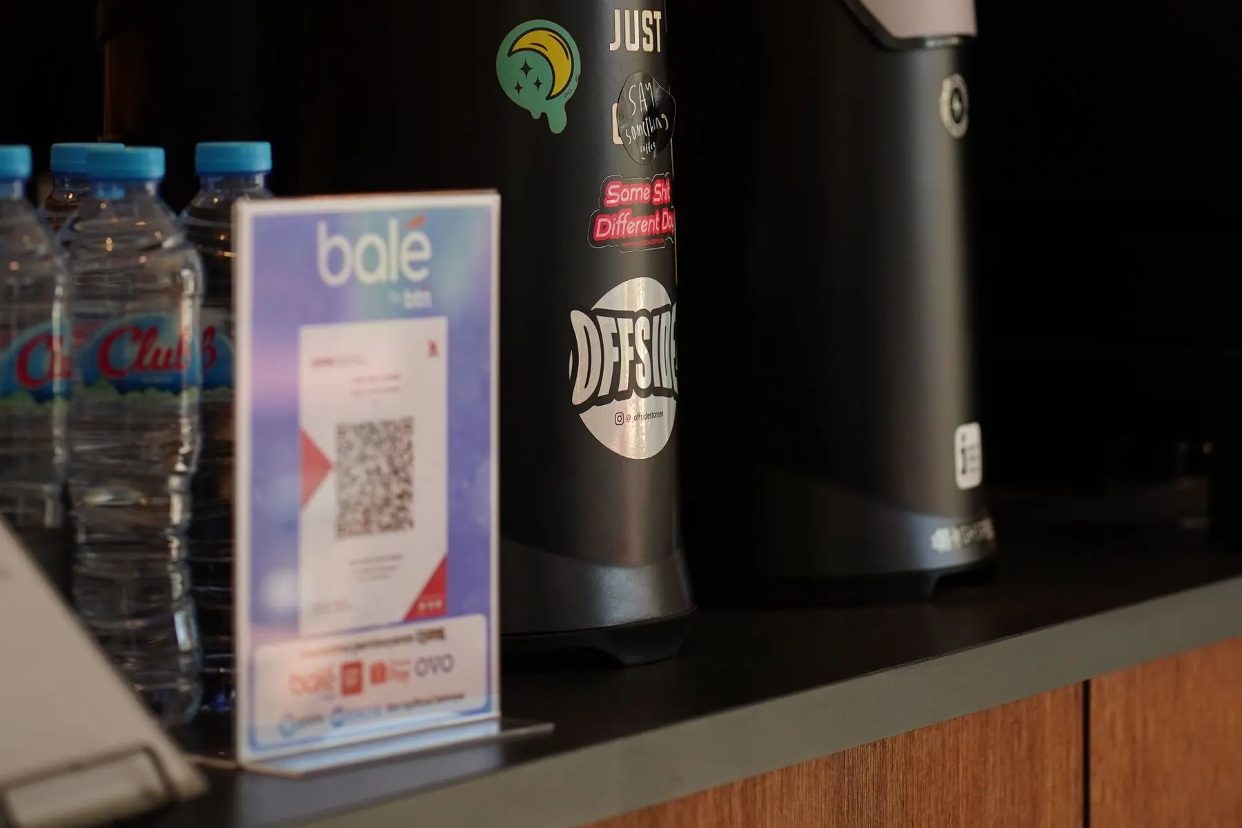 QR payment sign displayed at a cafe counter