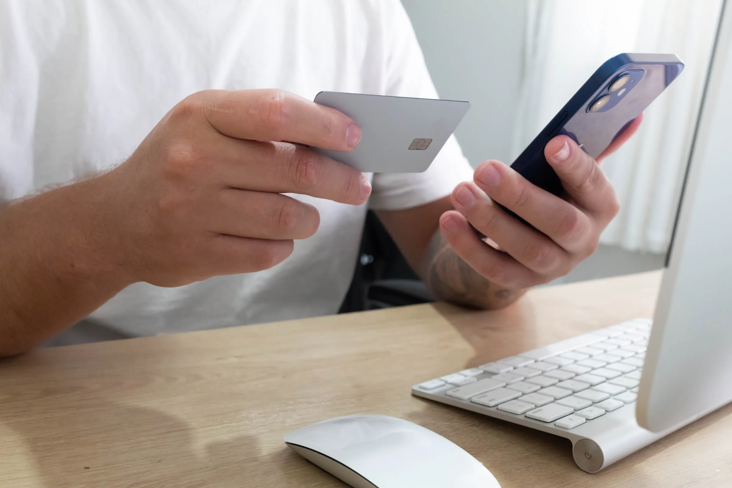 Traveler adding a bank card to a payment app on a smartphone