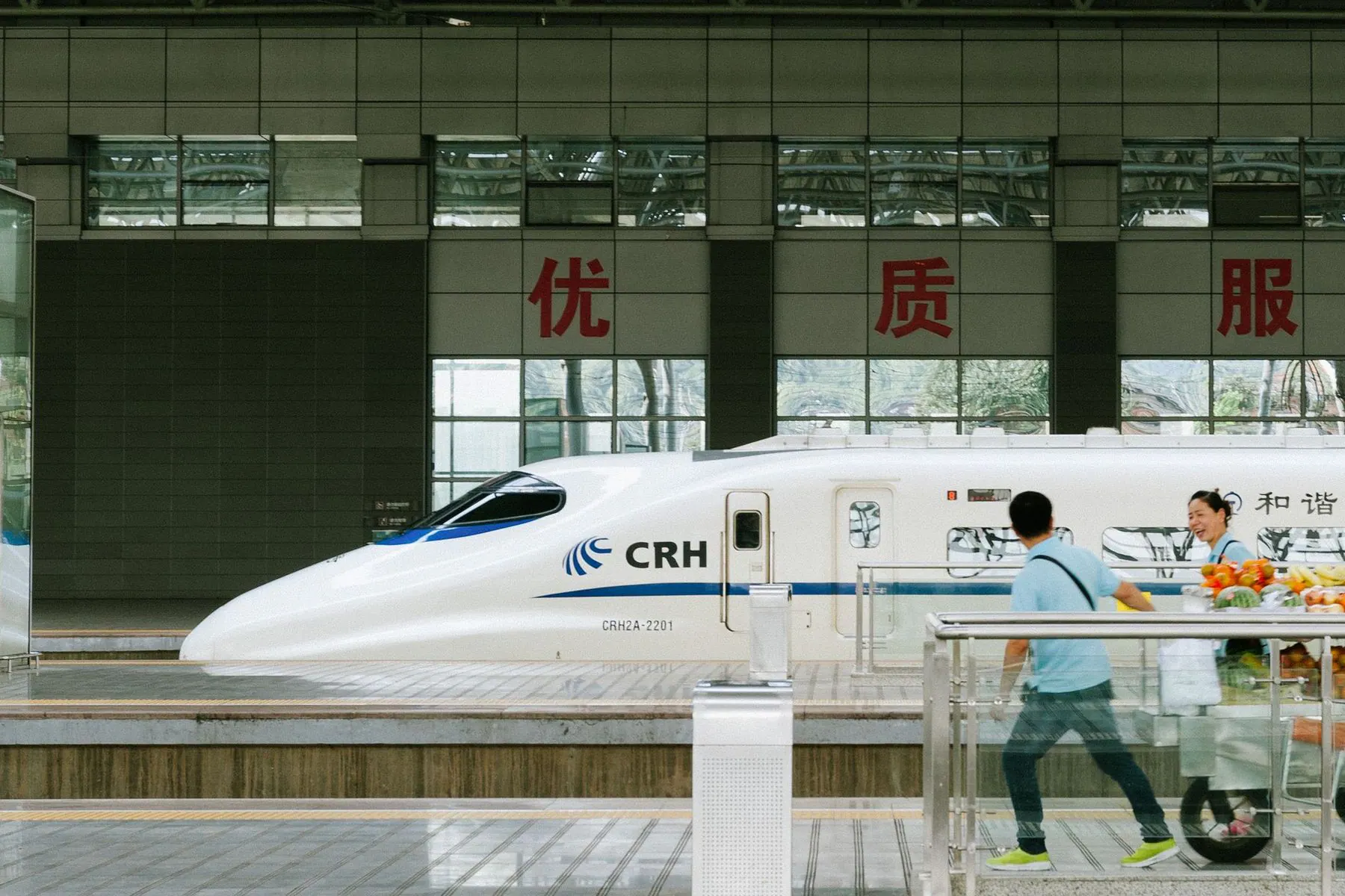Chinese CRH high-speed train beside a station platform