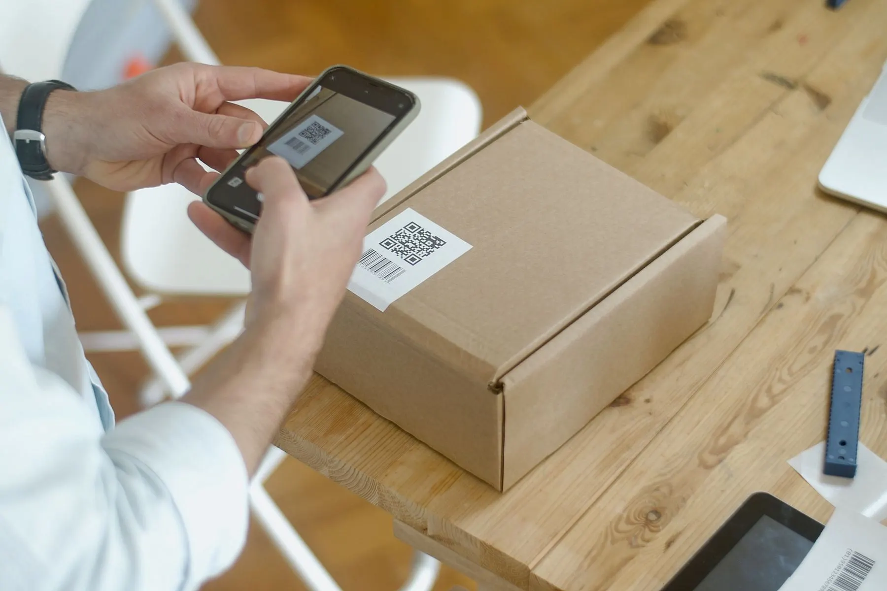 Person scanning a merchant QR code with a smartphone