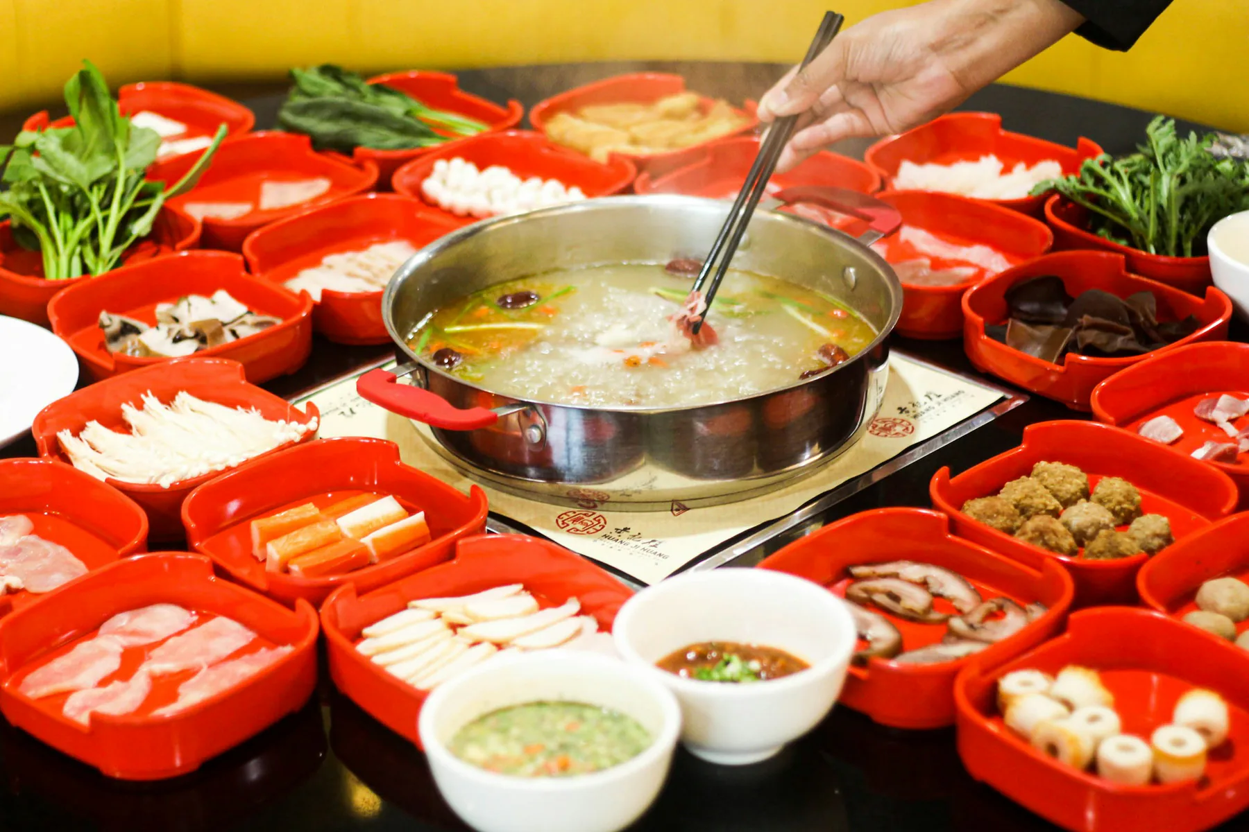 Beef and vegetables arranged around a Chaoshan-style hot pot