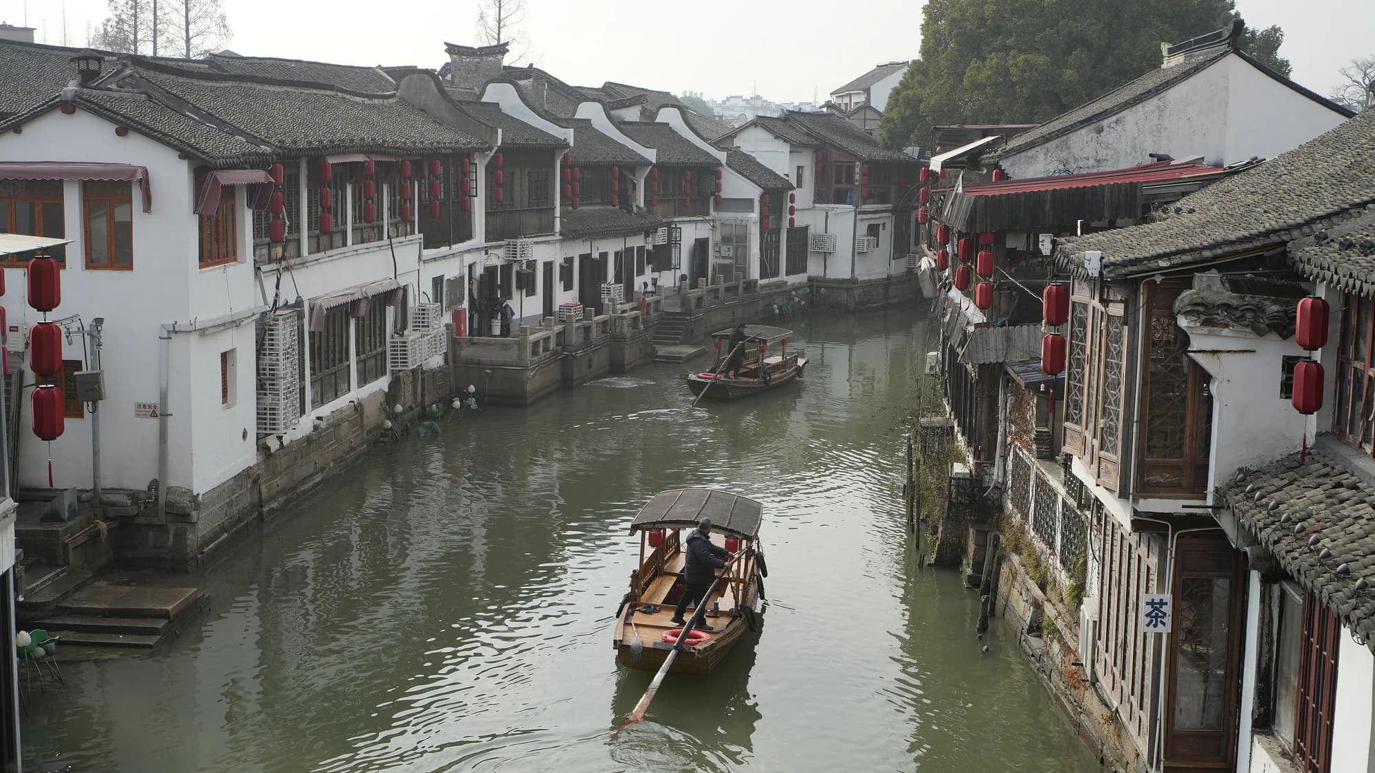 Canal, stone bridge, and waterside houses in Zhujiajiao water town