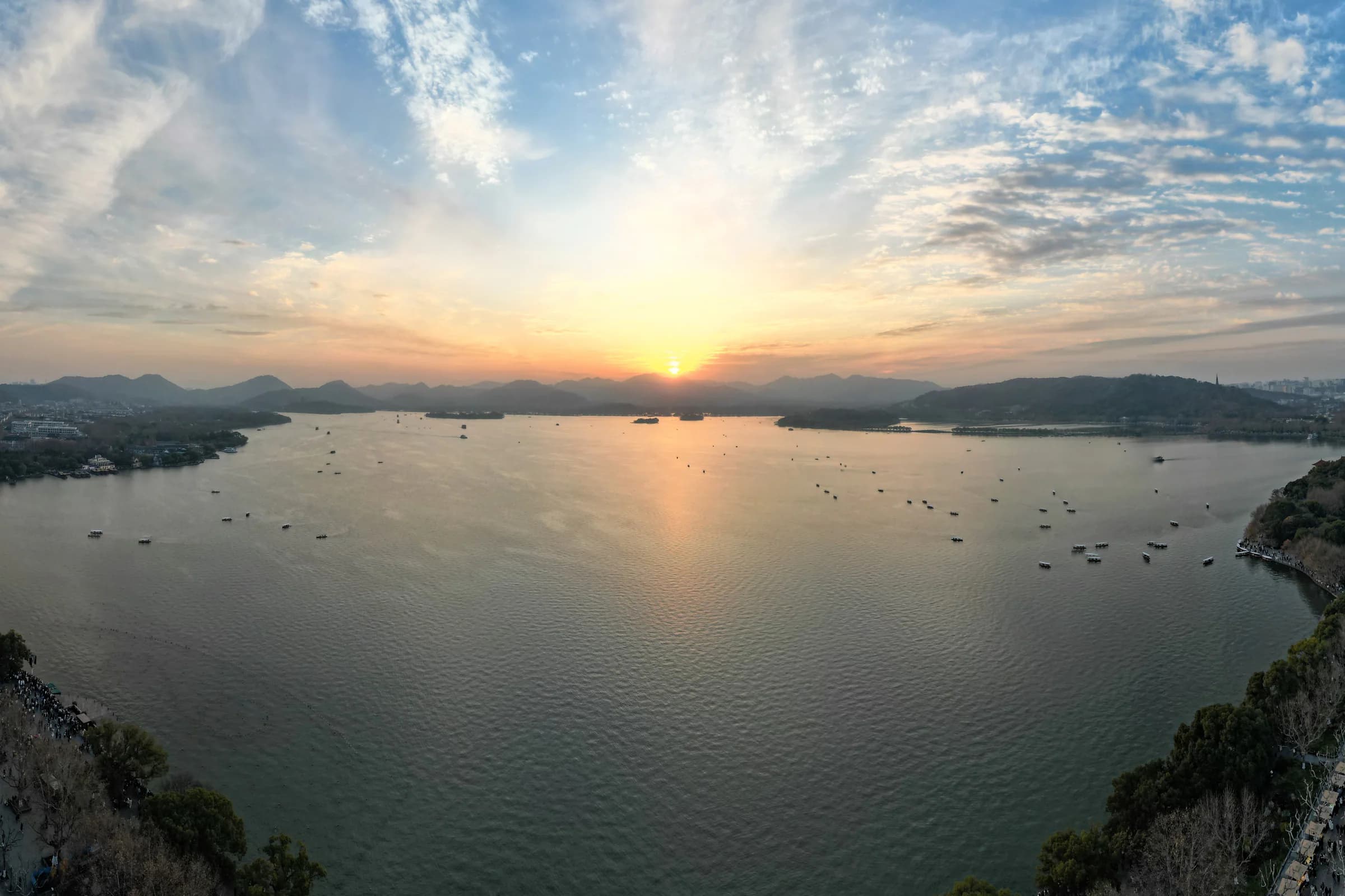 West Lake and the Hangzhou skyline at sunset
